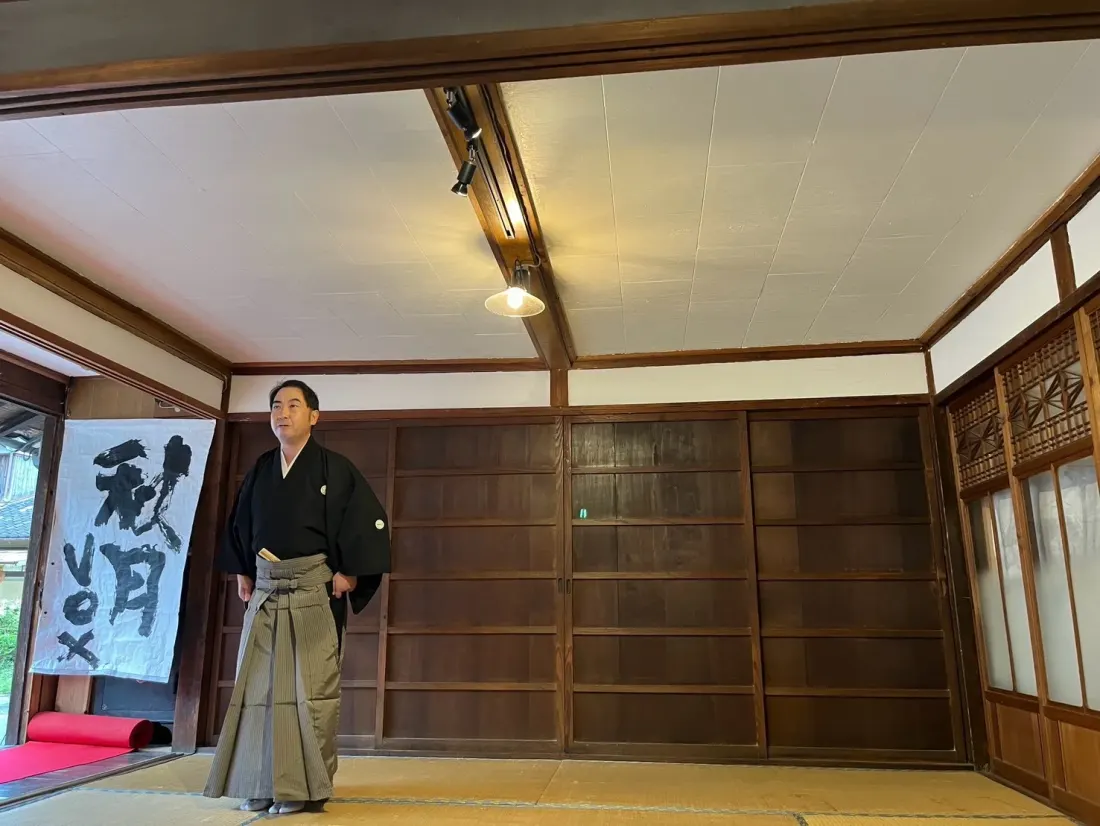 Kyogen performer in a traditional room